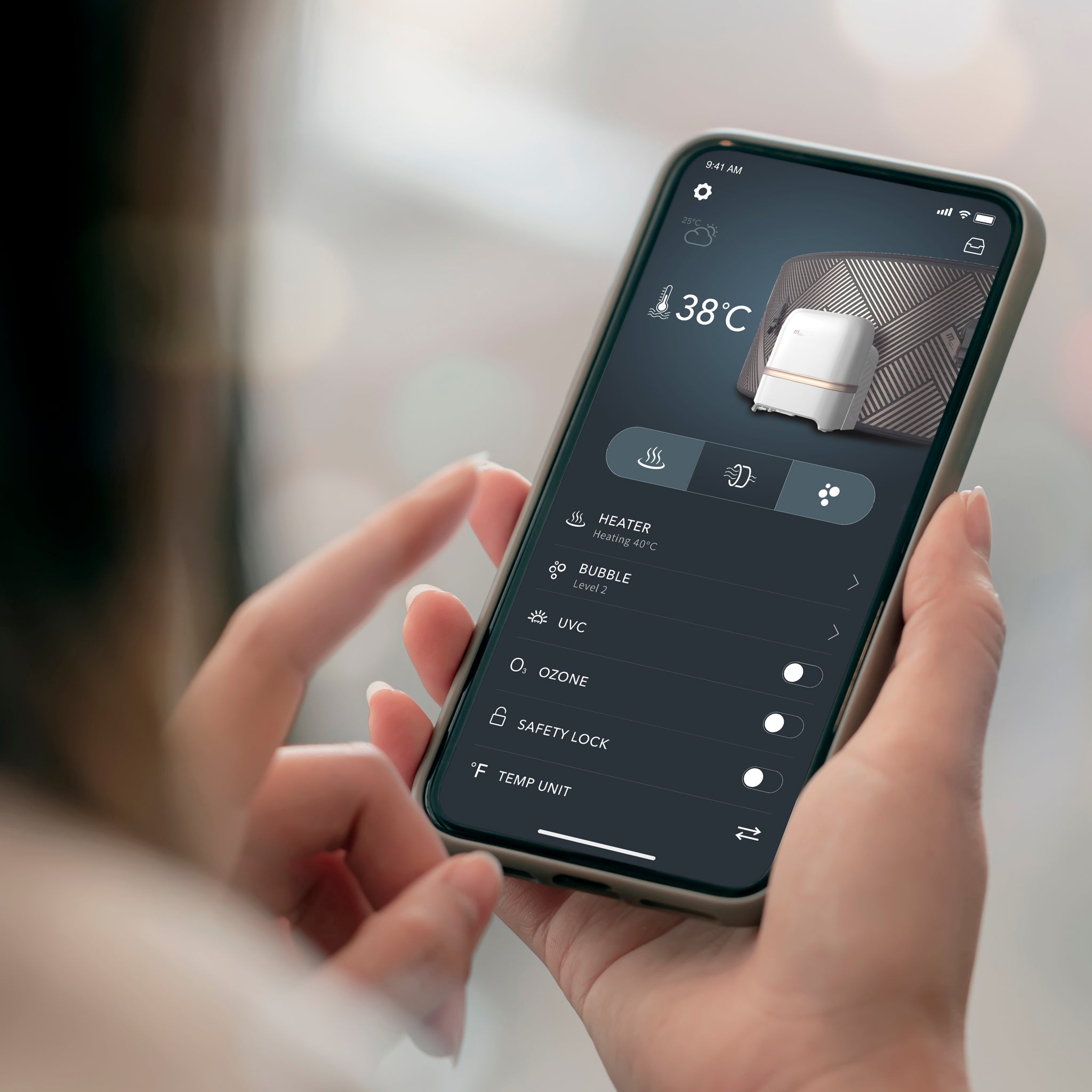 Close up image of a woman holding a smartphone in her hands with the MSpa App displayed on the screen, showing various control options for the hot tub jacuzzi range.